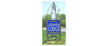 Lighthouse Lodge sign with contact information.