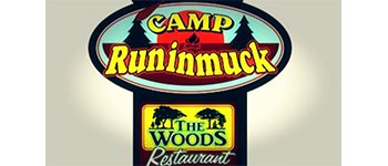 Sign for Camp Runinmuck and The Woods.