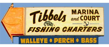 Tibbels Marina Fishing Charters signboard.