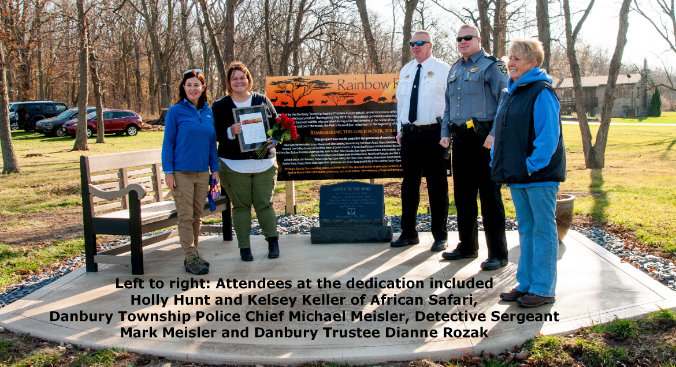 Group of people at outdoor dedication ceremony.