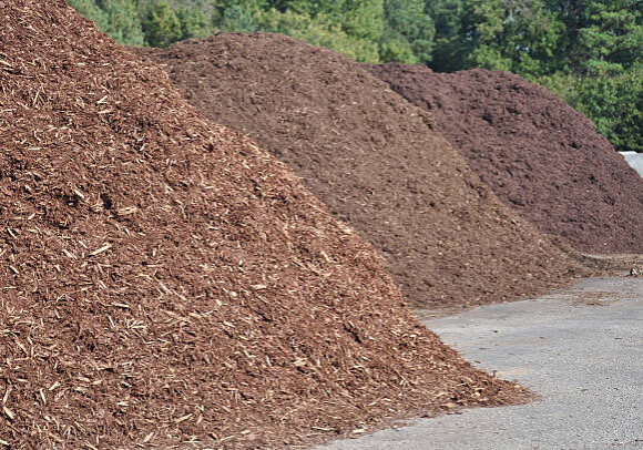 three different types of mulch offered for sale at a garden supply center three different types of mulch offered for sale at a garden supply center